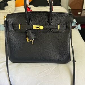 Black leather Chic Black Satchel with Gold Accents designer